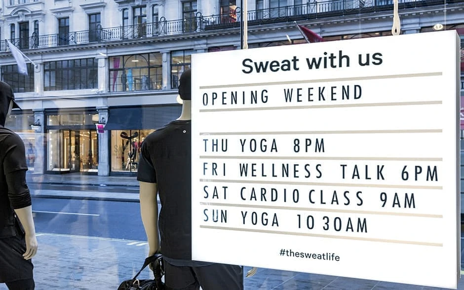 Retail shop advertising exercise classes in window display
