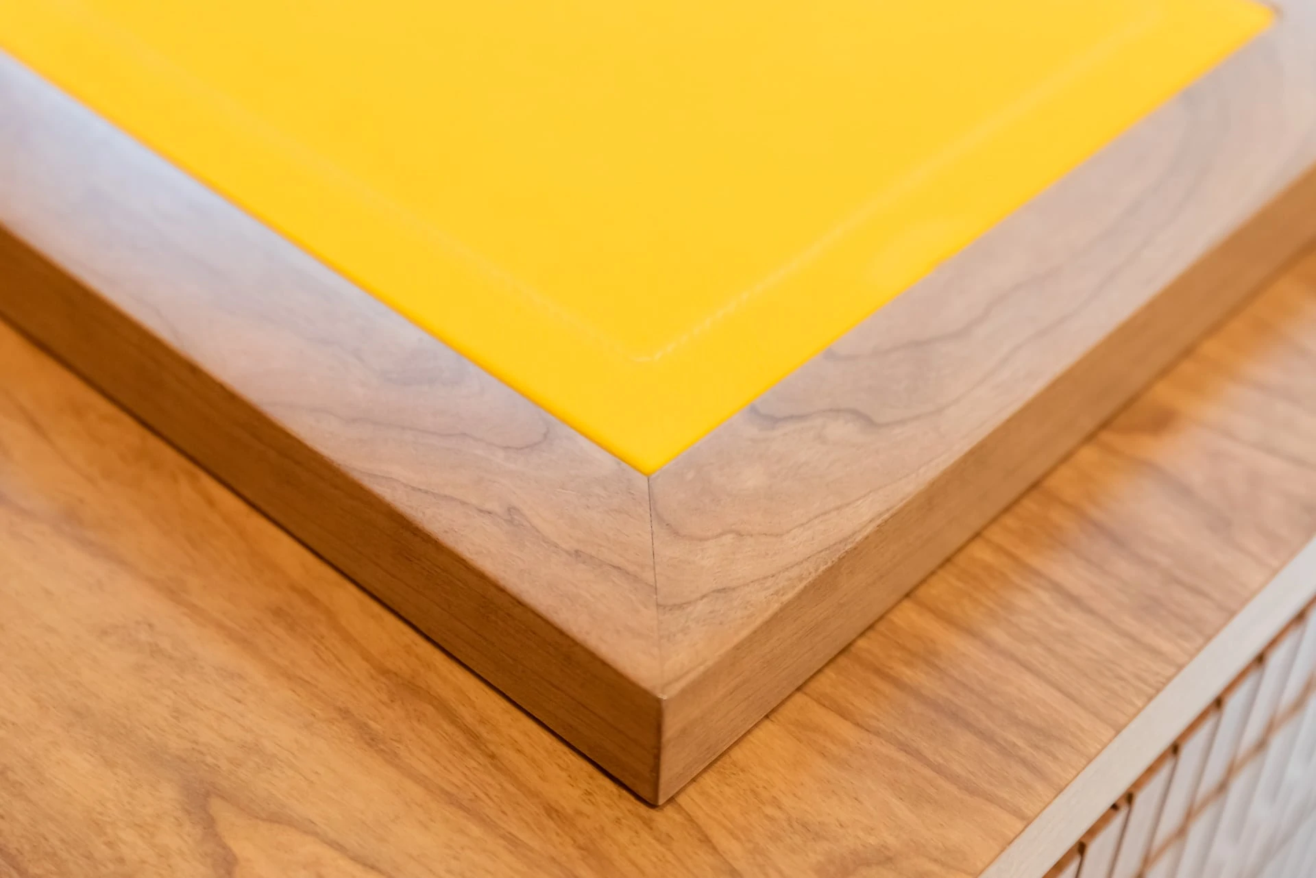 Wooden corner with yellow top of counter
