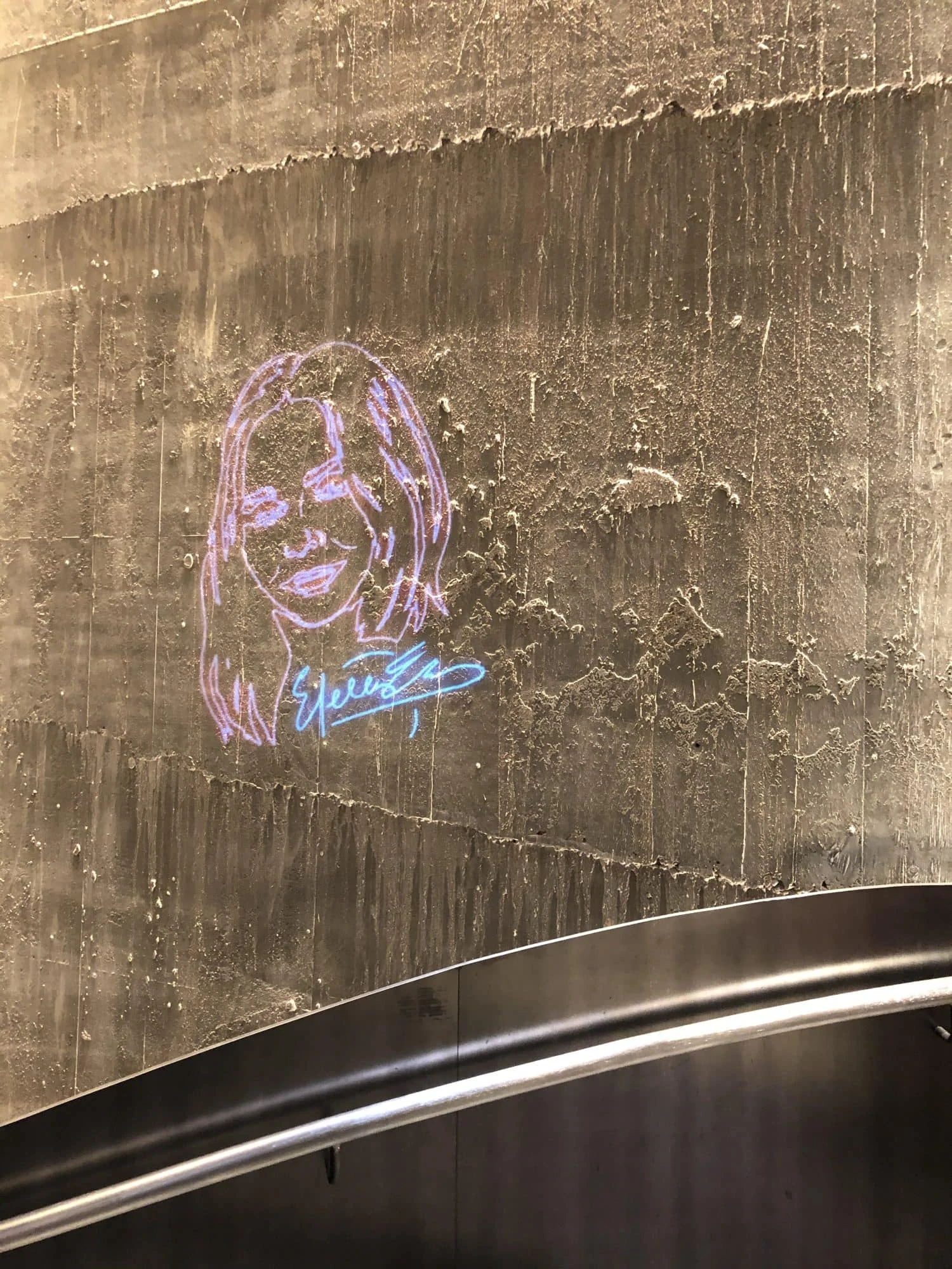 Stella mccartney's face painted on a wall