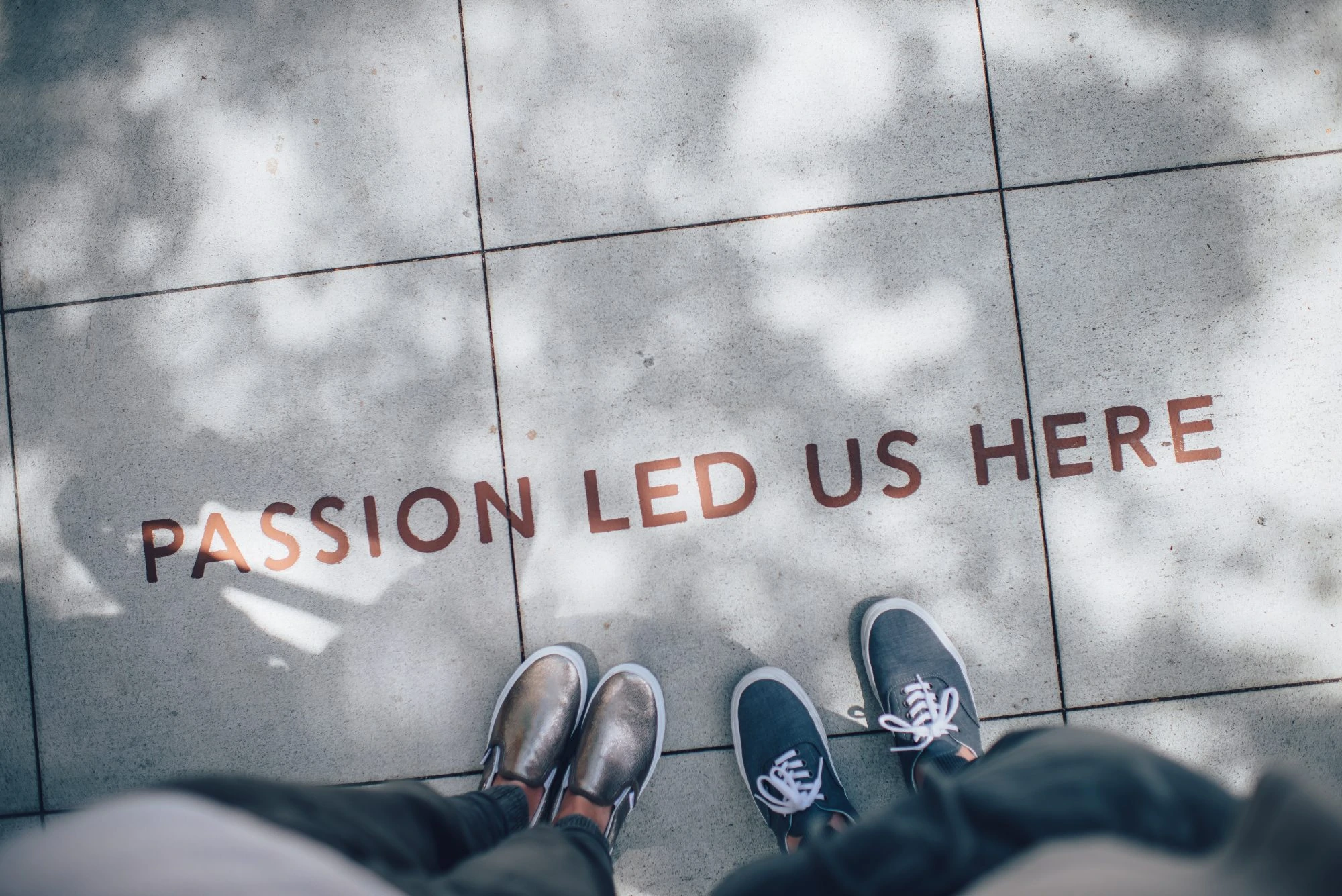 Passion lead us here on sidewalk