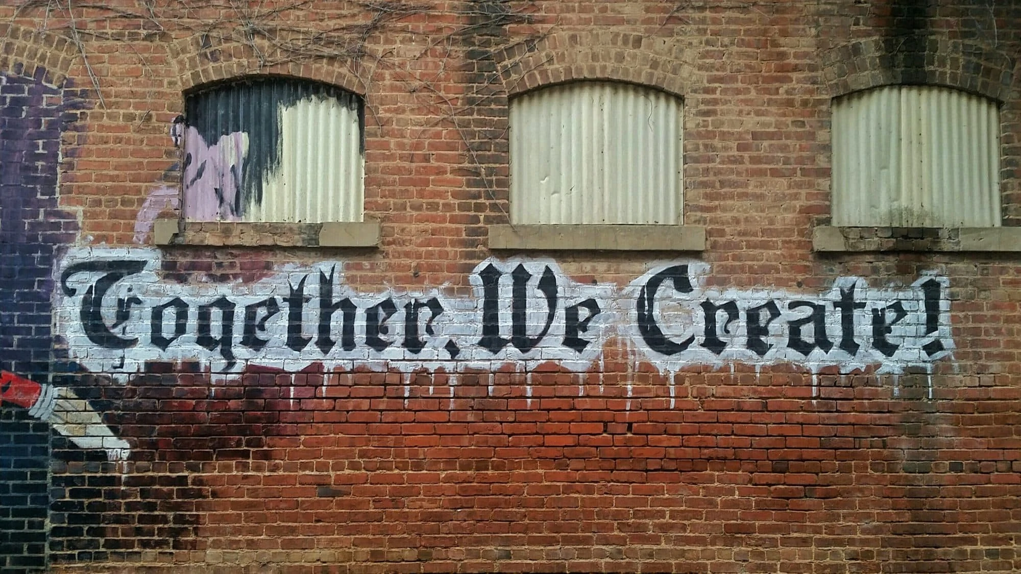 brand graphics on brick wall